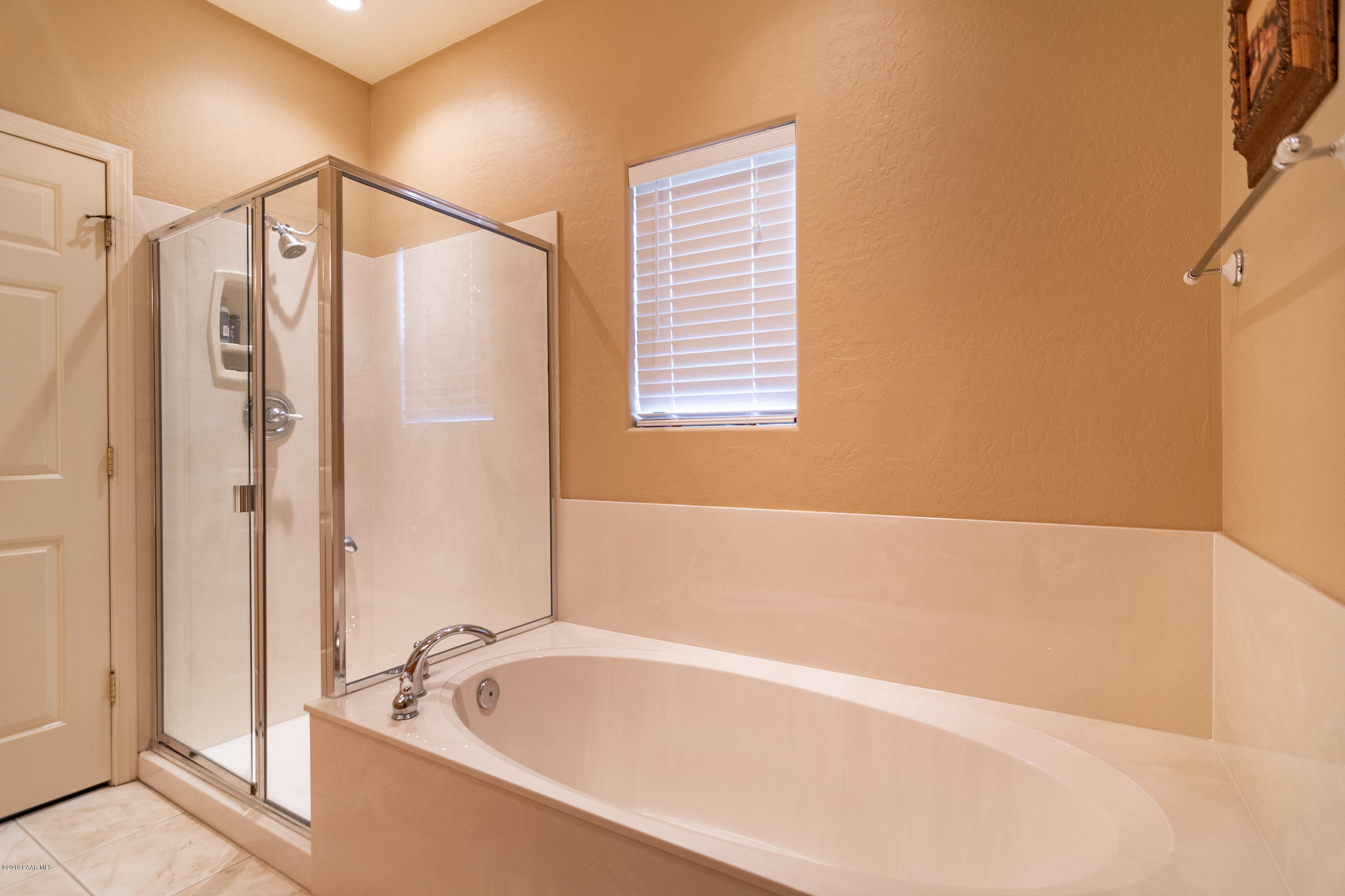4680 South Stoney Ridge Road Prescott, AZ 86303 - Photo 29 of 39 a bathroom with a bathtub and a shower