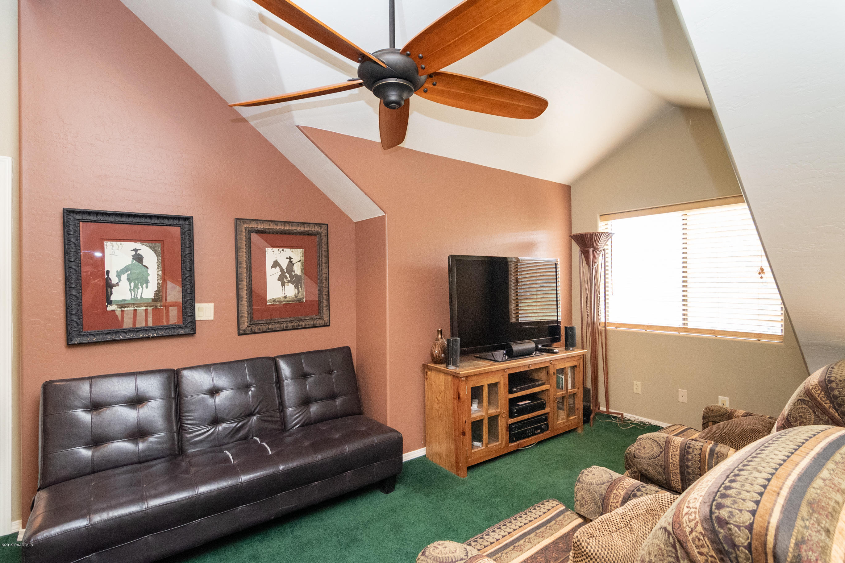 4680 South Stoney Ridge Road Prescott, AZ 86303 - Photo 33 of 39 a living room with furniture and a flat screen tv