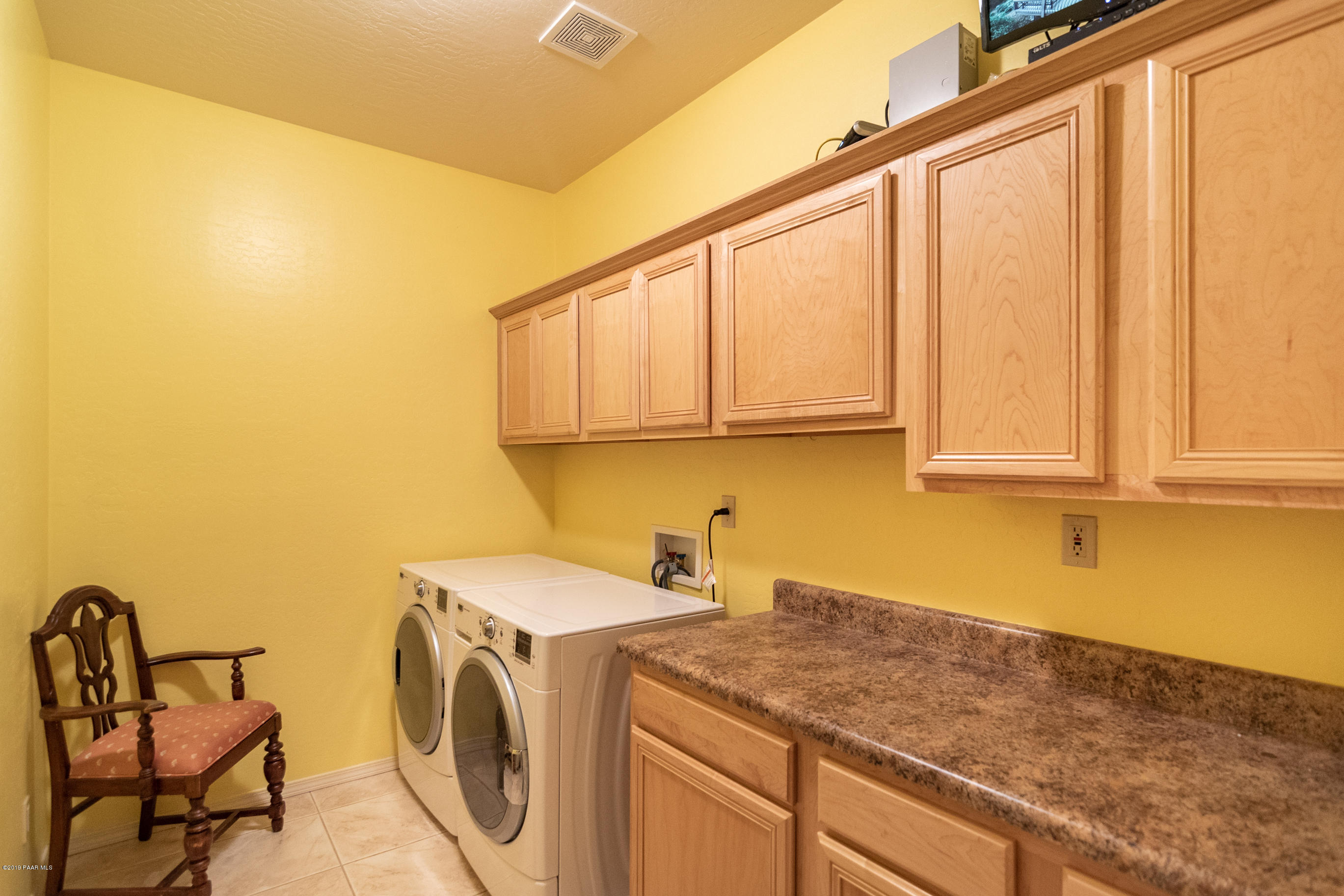 4680 South Stoney Ridge Road Prescott, AZ 86303 - Photo 39 of 39 a utility room with a sink a washer and dryer