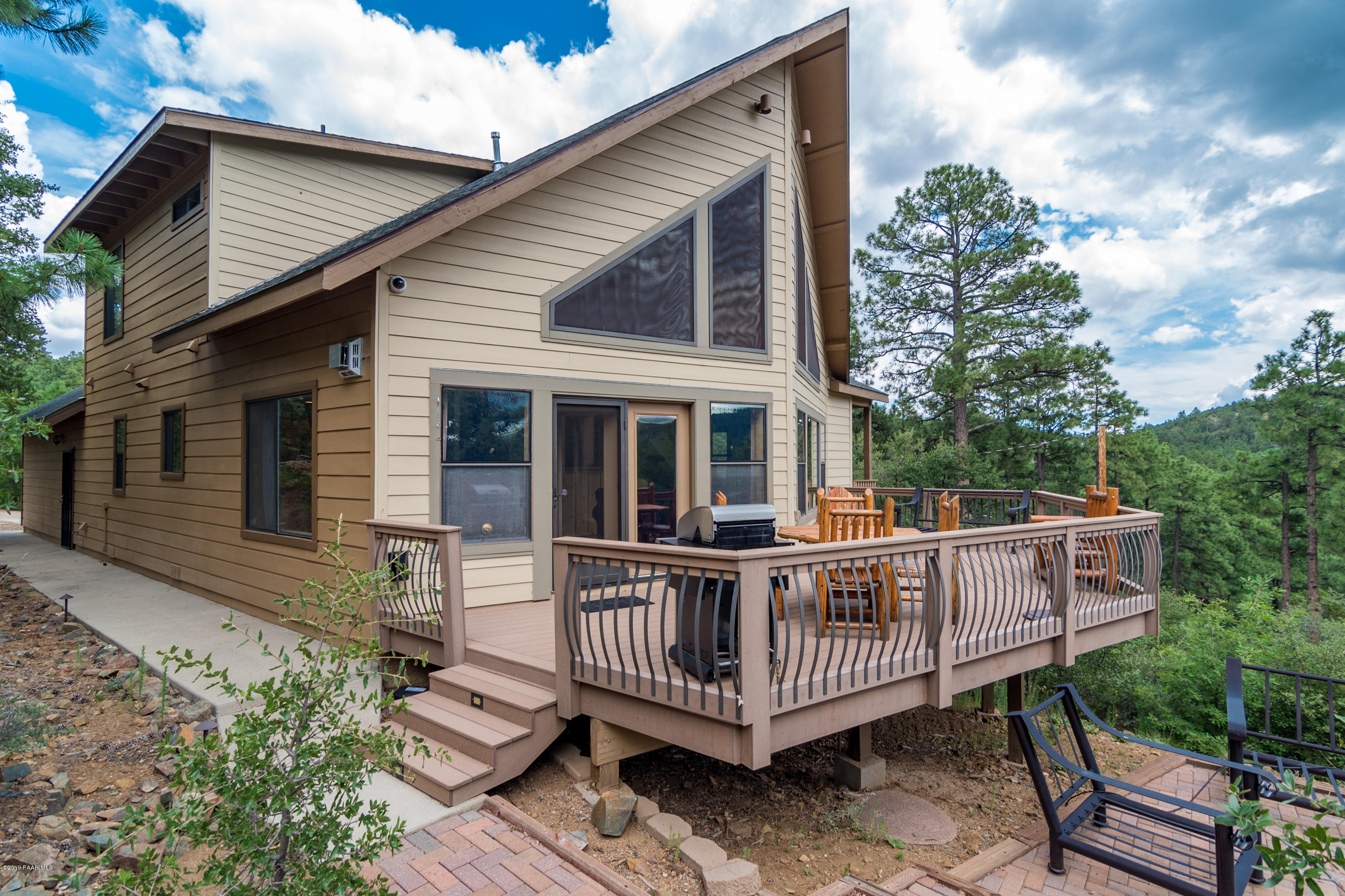 4680 South Stoney Ridge Road Prescott, AZ 86303 - Photo 4 of 39 a view of a house with a wooden deck