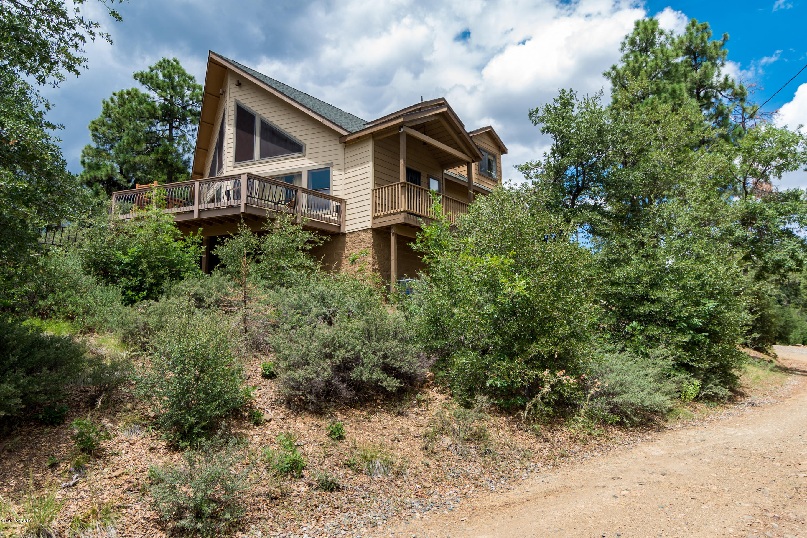 4680 South Stoney Ridge Road Prescott, AZ 86303 - Photo 6 of 39 a view of a house with a yard and plants
