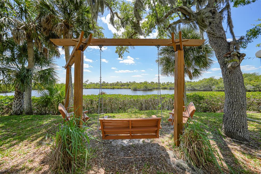 10303 Burnt Store Road, Unit 143 Punta Gorda, FL 33950 - Photo 37 of 42 a view of a garden with a tree