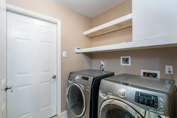 a bathroom with a sink toilet and mirror