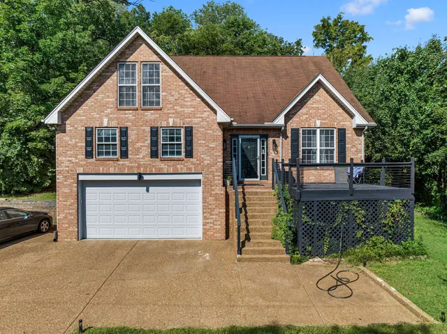 a view of house and outdoor space with yard