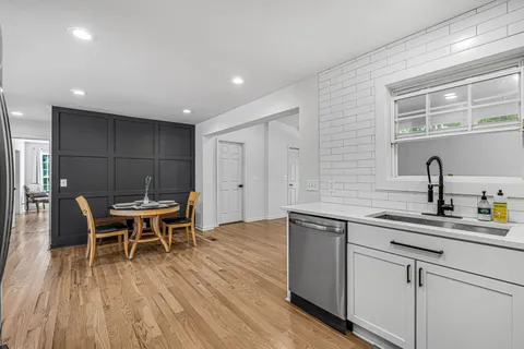 a kitchen with a refrigerator stove and sink