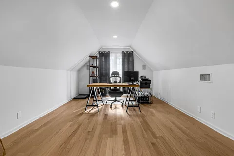 a view of room with wooden floor and chair