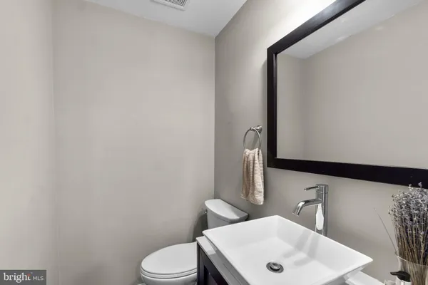 a bedroom with a bed and glass window