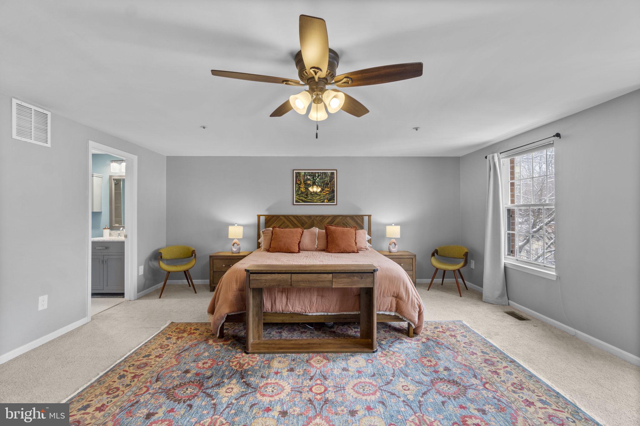 6025 Weekend Way, Unit 43 Columbia, MD 21044 - Photo 16 of 37 a bedroom with a bed a chandelier and a window