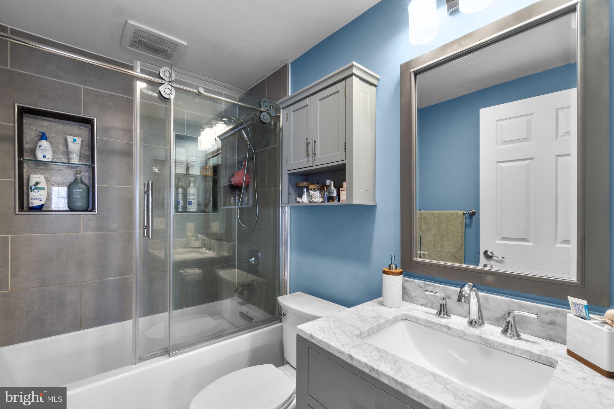 6025 Weekend Way, Unit 43 Columbia, MD 21044 - Photo 21 of 37 a bathroom with a granite countertop sink toilet and shower