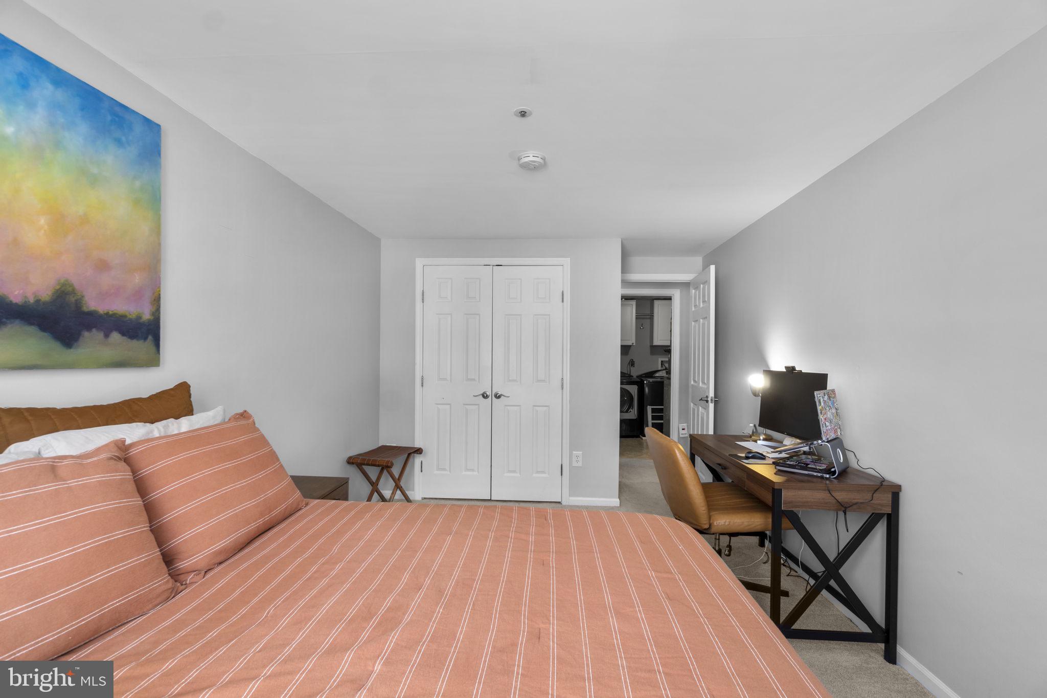 6025 Weekend Way, Unit 43 Columbia, MD 21044 - Photo 25 of 37 a bedroom with a bed and wooden floor