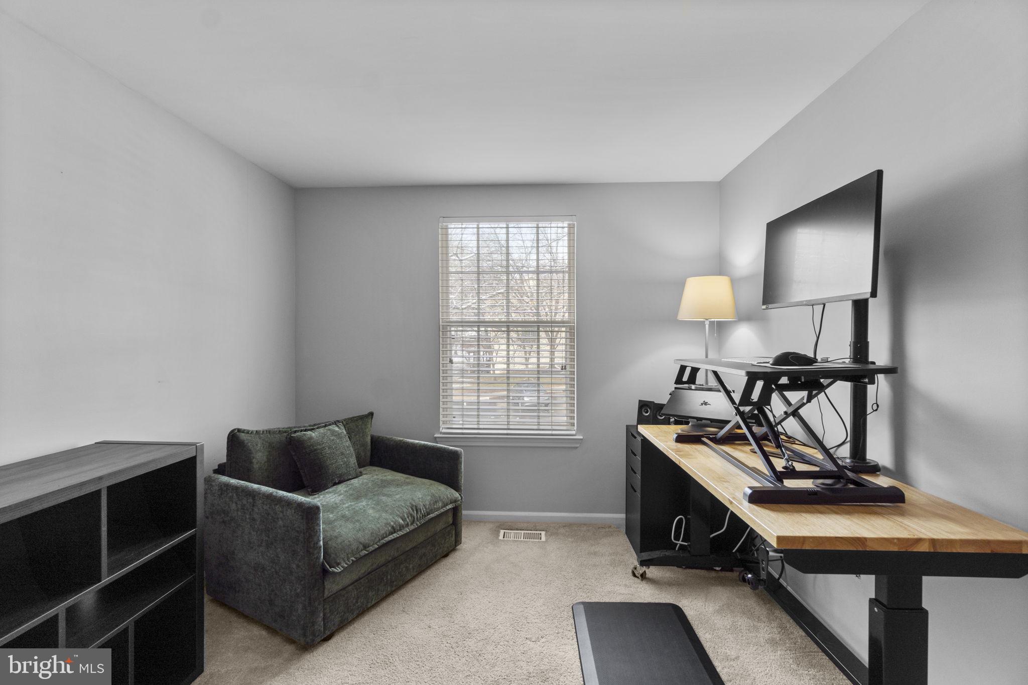 6025 Weekend Way, Unit 43 Columbia, MD 21044 - Photo 28 of 37 a living room with furniture and a window