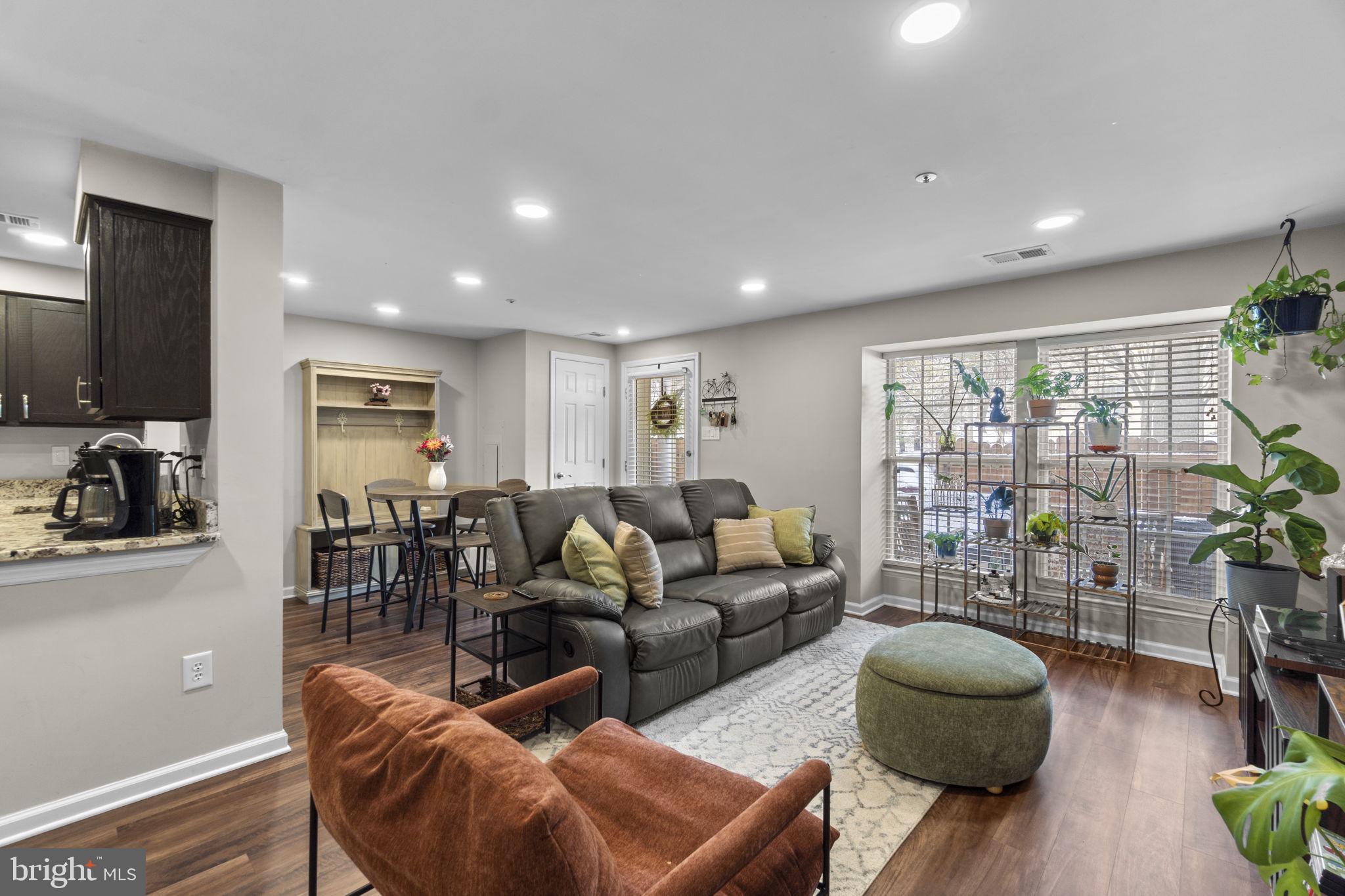 6025 Weekend Way, Unit 43 Columbia, MD 21044 - Photo 3 of 37 a living room with furniture and a flat screen tv