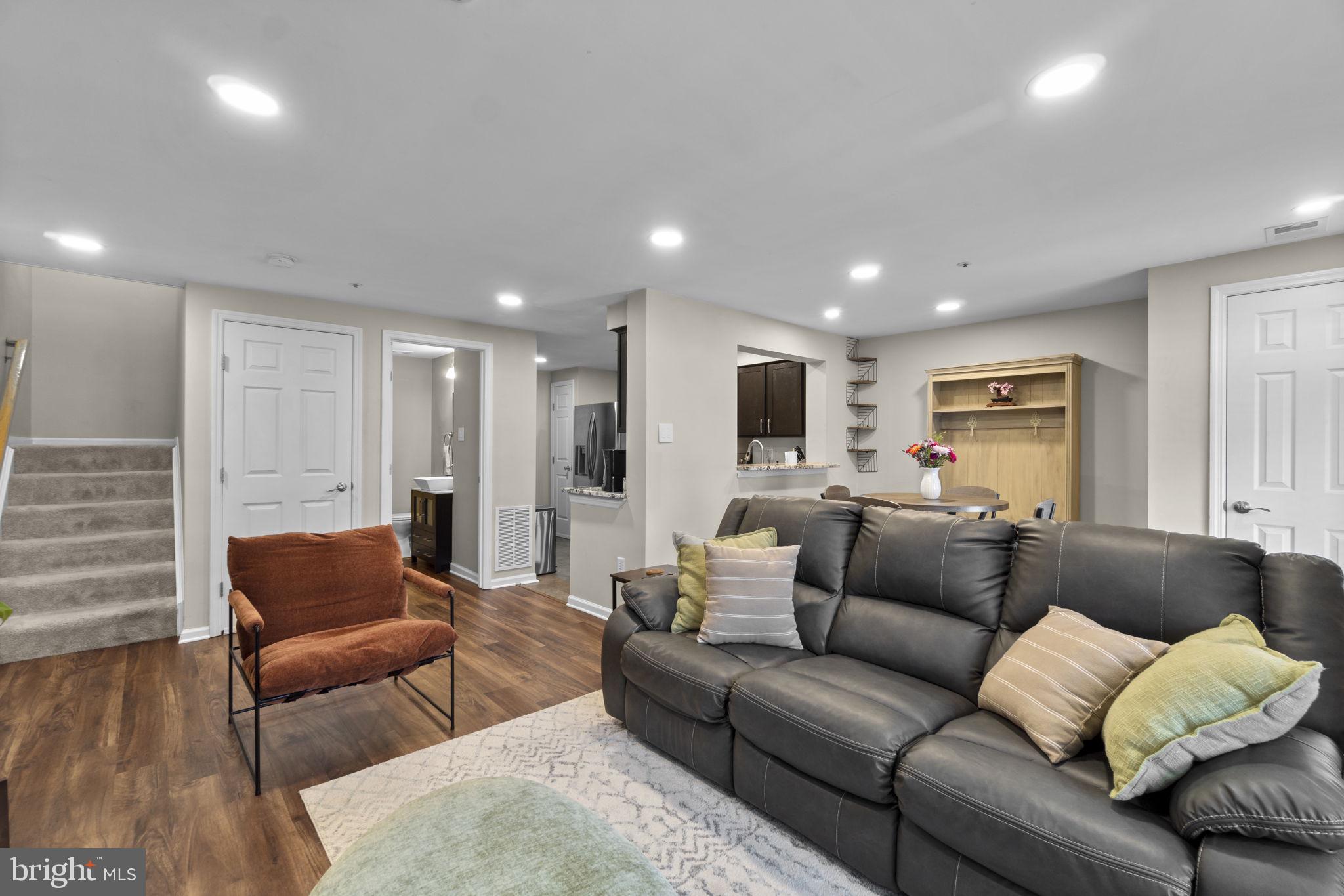 6025 Weekend Way, Unit 43 Columbia, MD 21044 - Photo 4 of 37 a living room with furniture and a couch