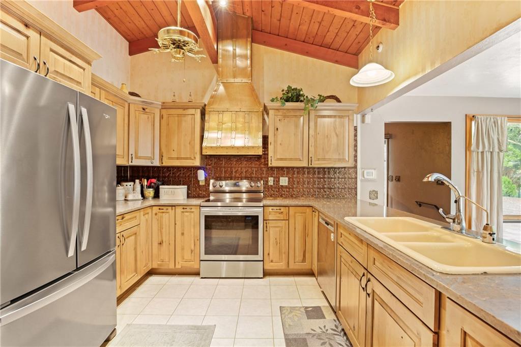 2100 Water Level Road Somerset, PA 15501 - Photo 17 of 49 a large kitchen with a sink stainless steel appliances and cabinets
