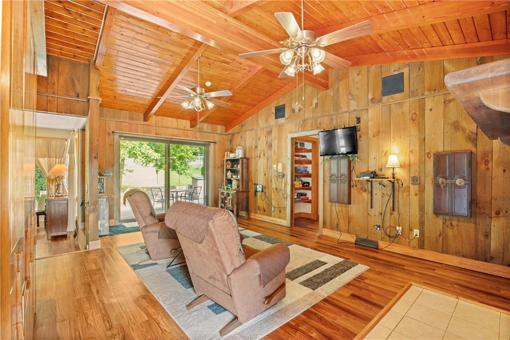 2100 Water Level Road Somerset, PA 15501 - Photo 20 of 49 a living room with furniture a wooden floor and a chandelier