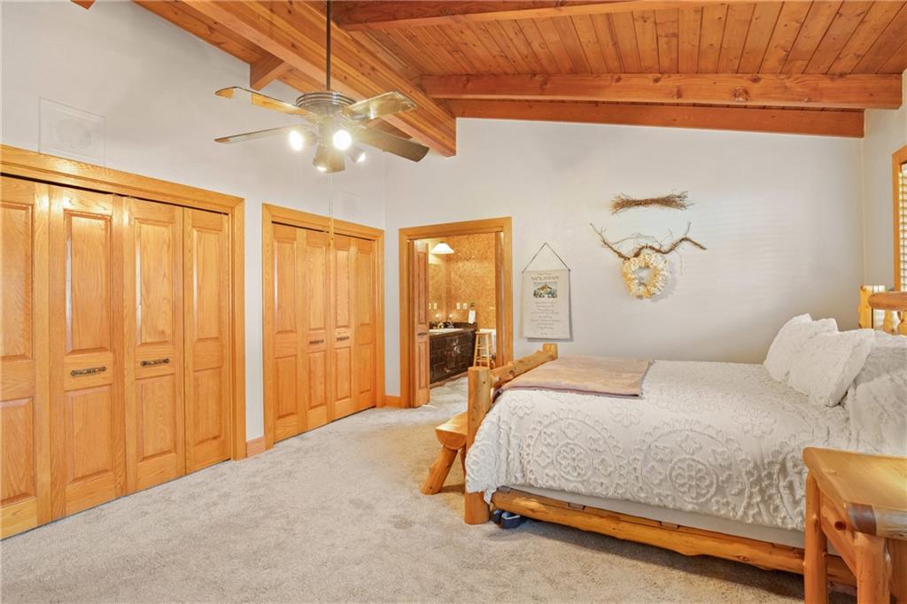 2100 Water Level Road Somerset, PA 15501 - Photo 22 of 49 a bedroom with a bed and a chandelier