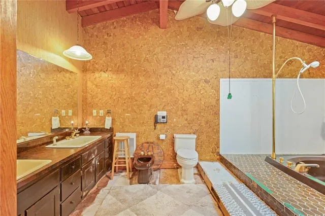 a bathroom with a sink a mirror and a shower