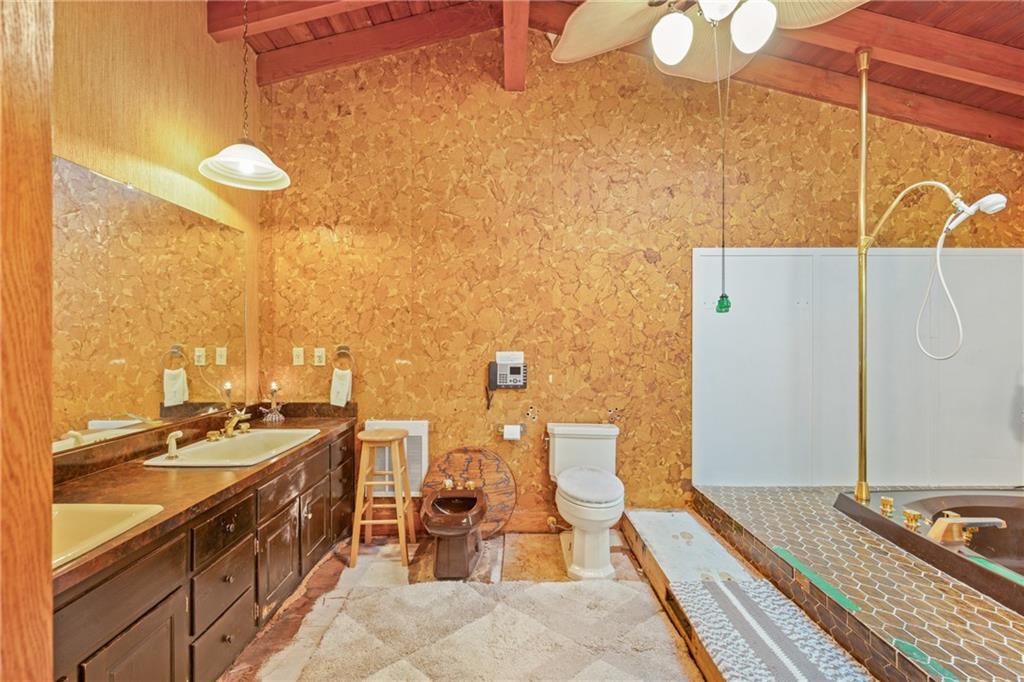 2100 Water Level Road Somerset, PA 15501 - Photo 23 of 49 a bathroom with a sink a mirror and a shower