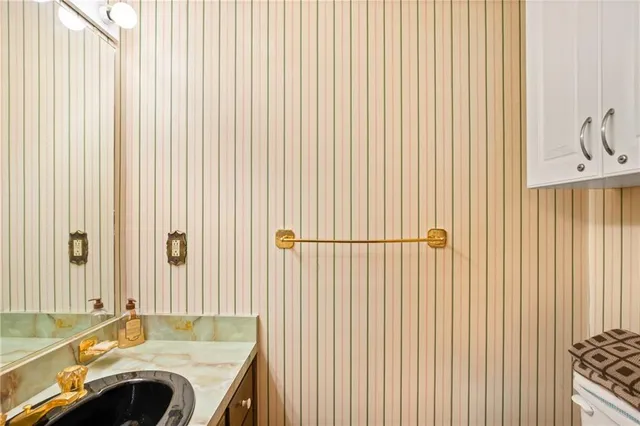 a view of a kitchen that has a sink and a stove in it