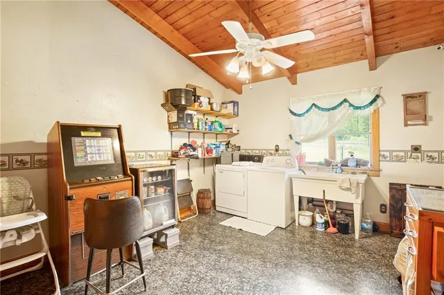 a room with table chairs and a dining table