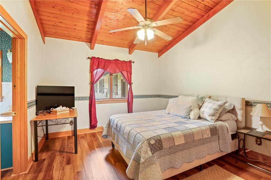 2100 Water Level Road Somerset, PA 15501 - Photo 29 of 49 a bedroom with a bed and a chandelier