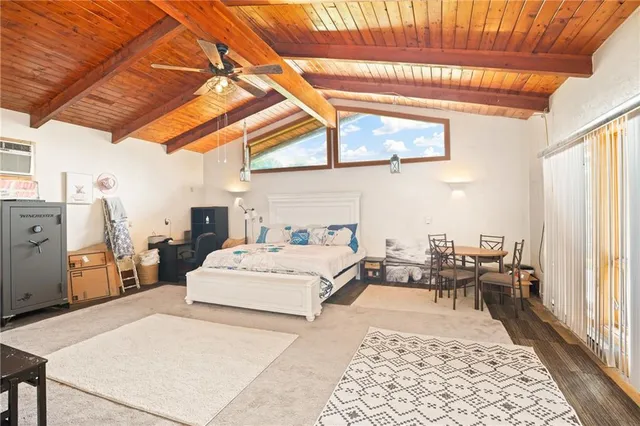 a bed room with a bed and a chair