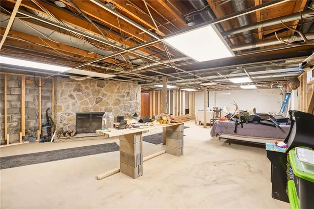 a view of a livingroom with furniture and a fireplace