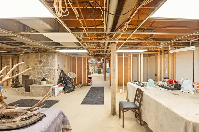 a room with gym equipment and a table