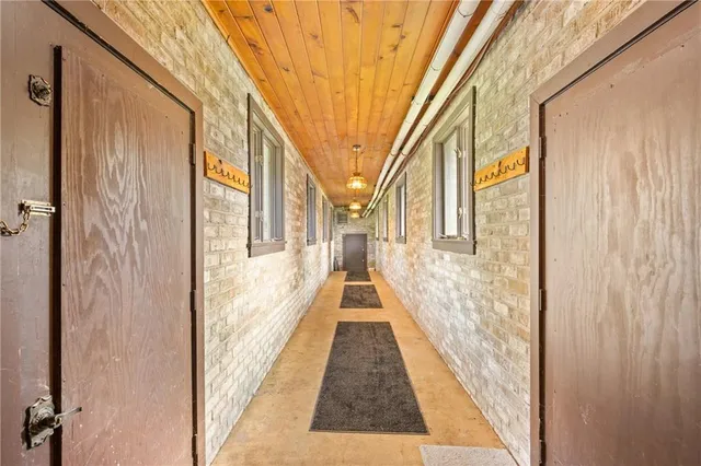 a view of a large building with wooden floor and windows