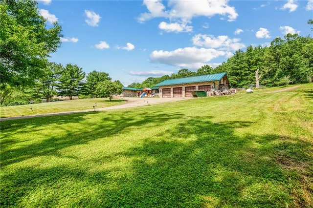 a view of an house with backyard and garden