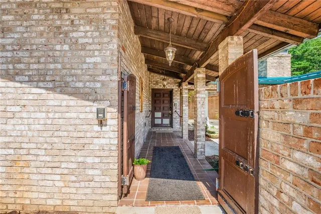 a view of a porch with wooden floor