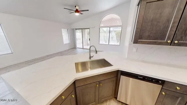 a view of a sink storage and utility room