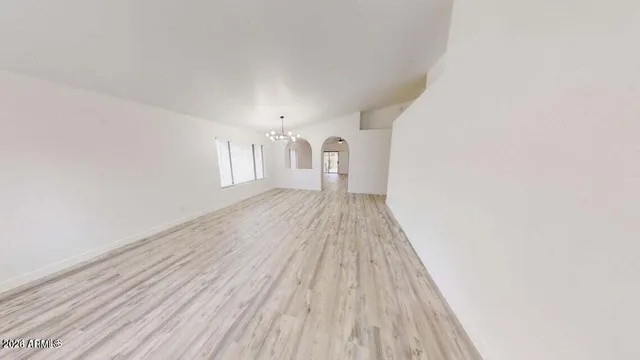 a view of a room with wooden floor