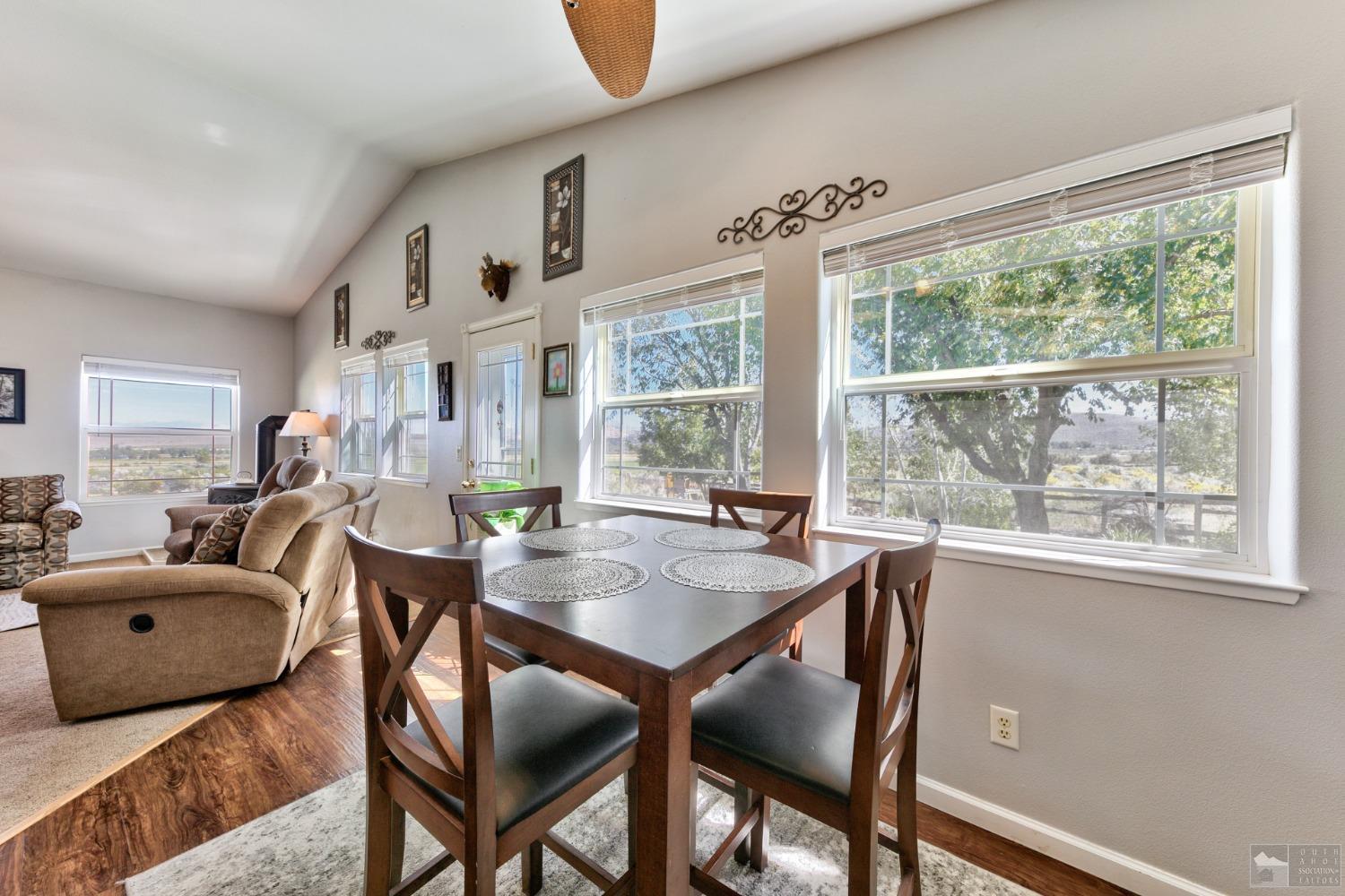 1111 Foothill Road Markleeville, CA 96120 - Photo 21 of 28 a view of a dining room with furniture large windows and wooden floor
