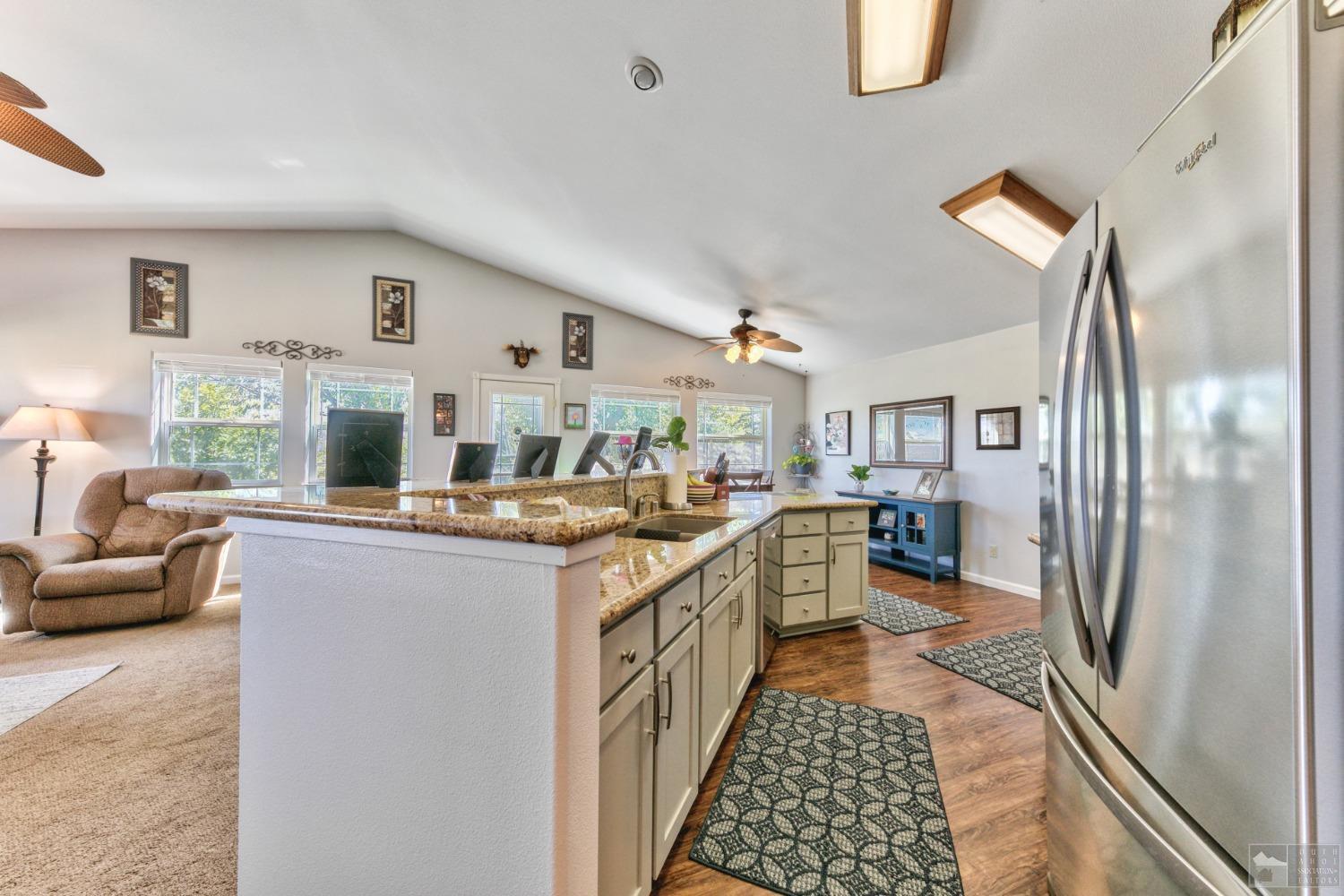 1111 Foothill Road Markleeville, CA 96120 - Photo 23 of 28 a kitchen with a sink and a refrigerator