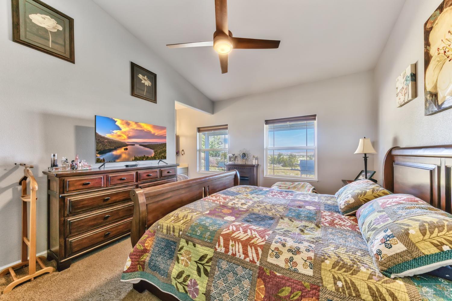 1111 Foothill Road Markleeville, CA 96120 - Photo 25 of 28 a bedroom with a bed and a flat screen tv