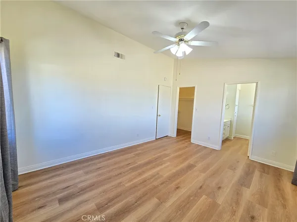 a view of a livingroom with a chandelier fan
