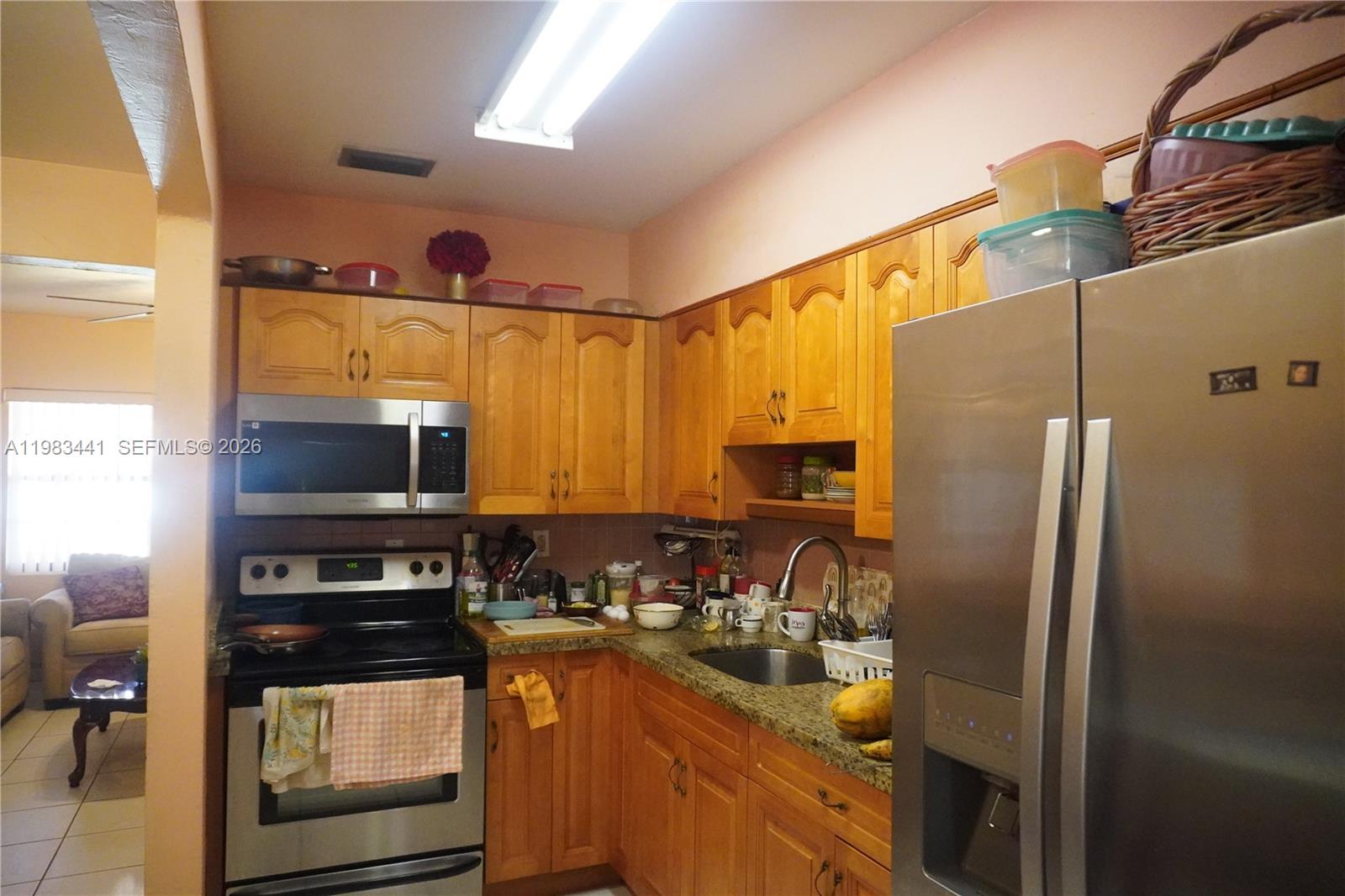 2660 Southwest 36th Avenue Miami, FL 33133 - Photo 15 of 32 a kitchen with a sink and refrigerator