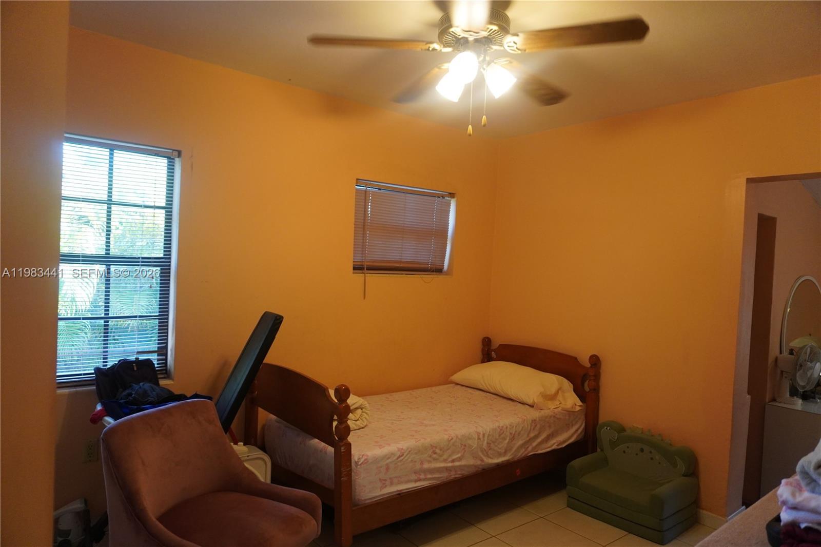 2660 Southwest 36th Avenue Miami, FL 33133 - Photo 18 of 32 a bedroom with a bed and window