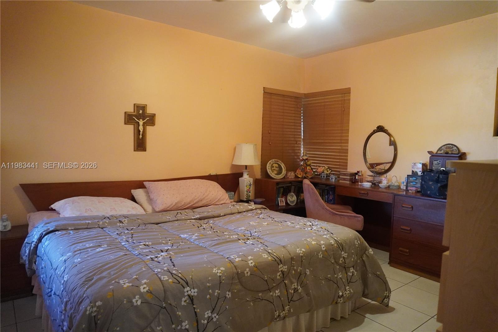 2660 Southwest 36th Avenue Miami, FL 33133 - Photo 22 of 32 a bed sitting in a bedroom next to a lamp