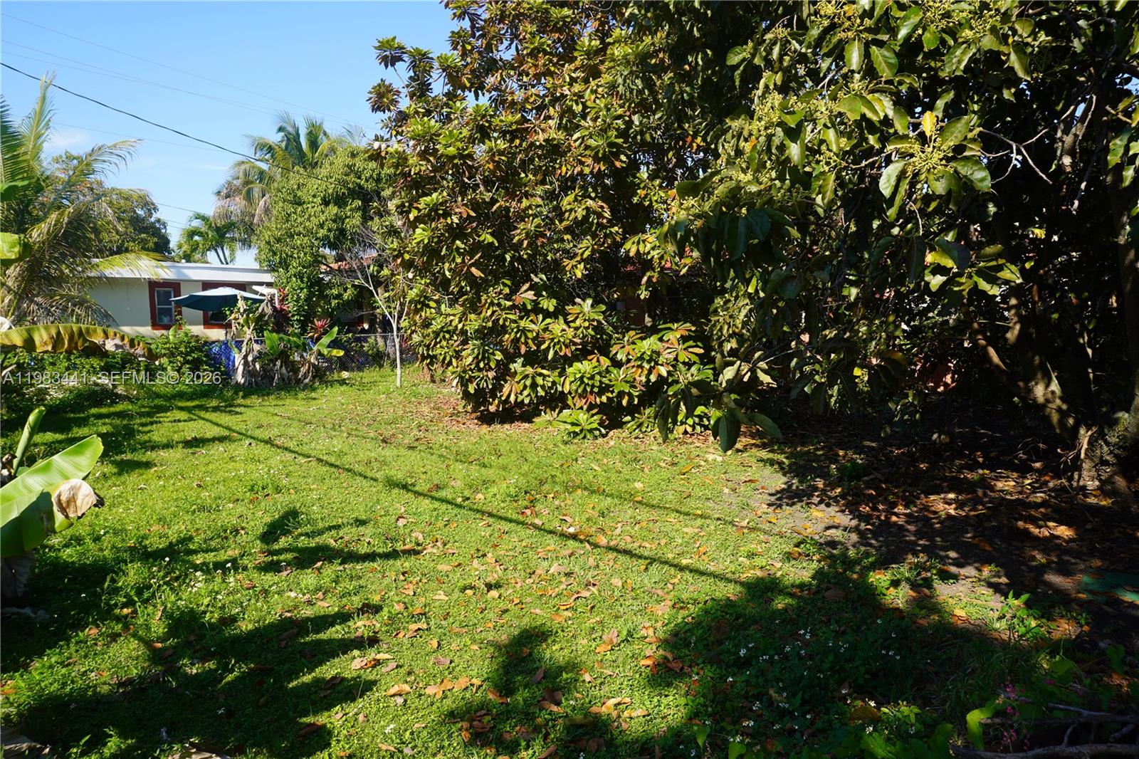 2660 Southwest 36th Avenue Miami, FL 33133 - Photo 26 of 32 a yellow building with trees in front of it
