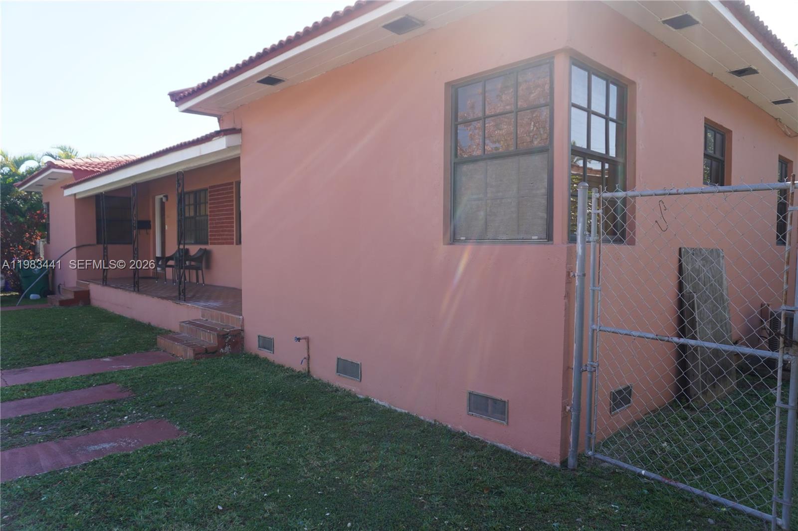 2660 Southwest 36th Avenue Miami, FL 33133 - Photo 3 of 32 a view of backyard with barbeque grill and wooden fence