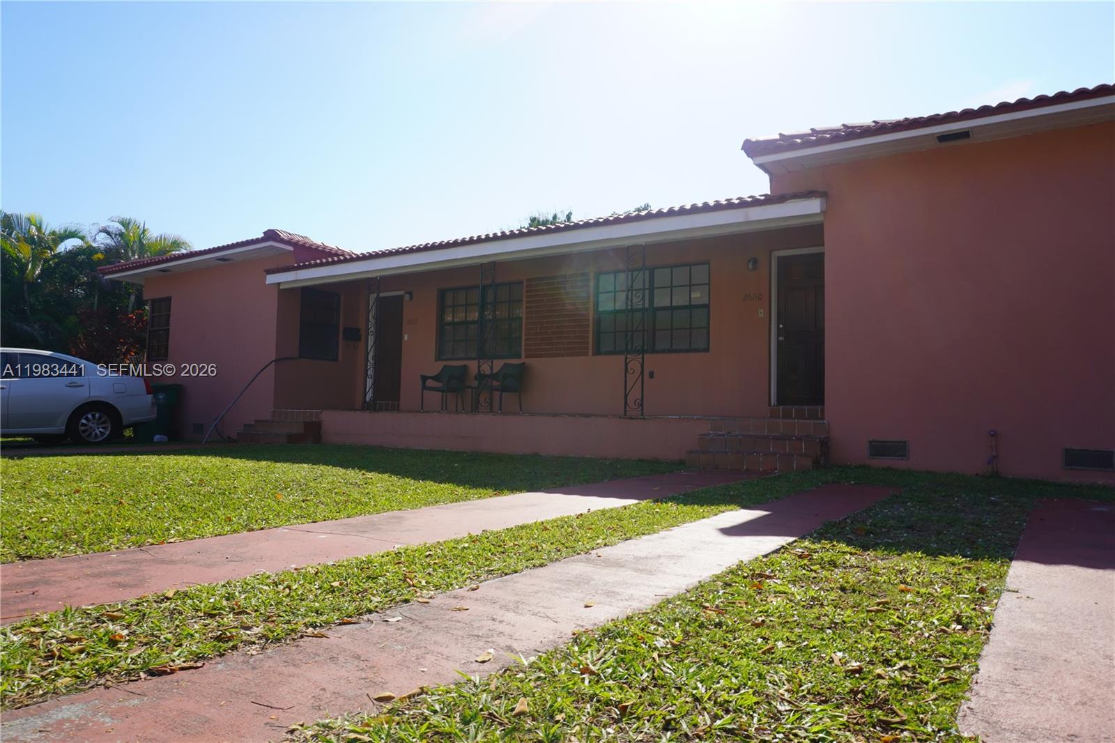 2660 Southwest 36th Avenue Miami, FL 33133 - Photo 8 of 32 a front view of a house with a garden and yard