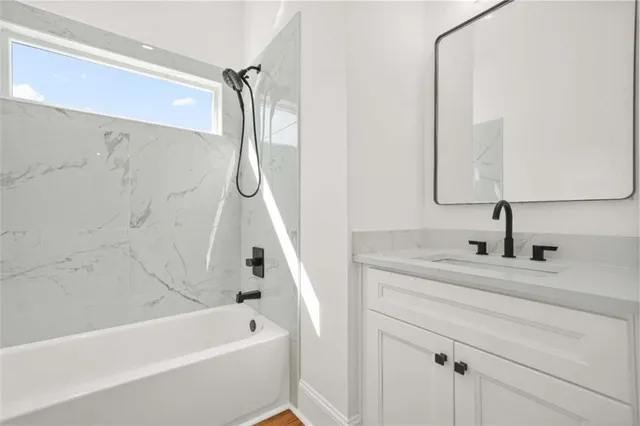 a view of a wooden deck next to a yard