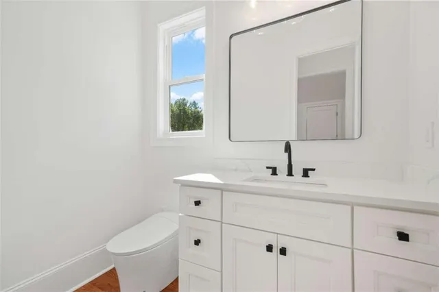 a front view of a house with a yard table and chairs