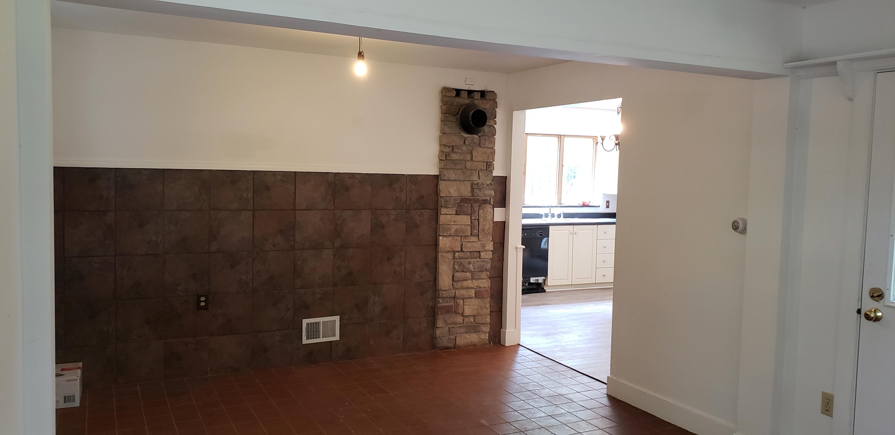 115 Rooks Road Eddington, ME 04428 - Photo 13 of 44 Entry from lite wall to kitchen & woodst
