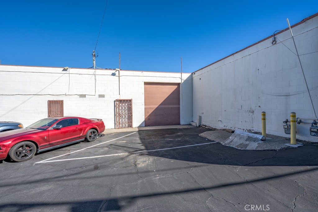 24609 Arch Street Newhall, CA 91321 - Photo 13 of 23 roll up door view from back of unit