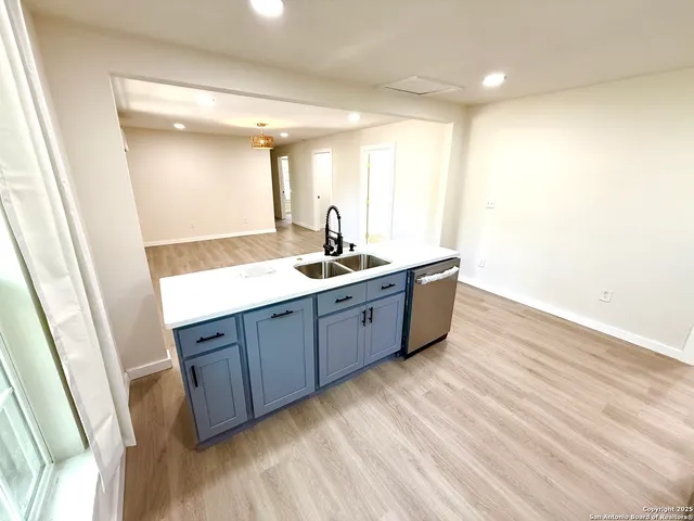 a bathroom with a double vanity sink and mirror