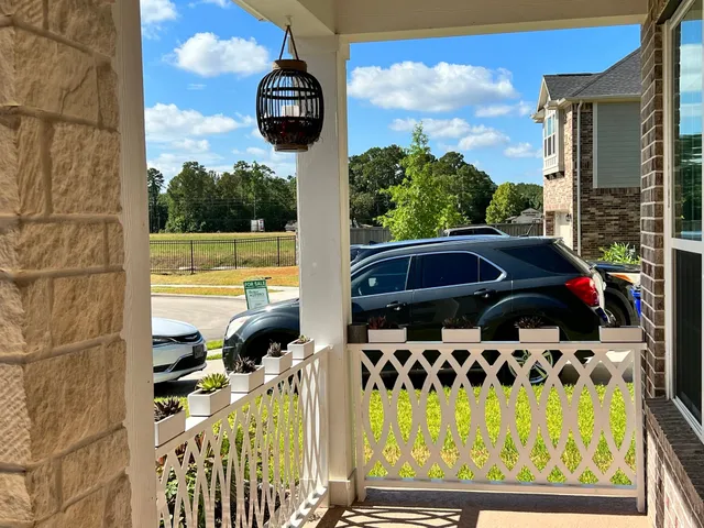 a view of balcony and yard with swimming pool