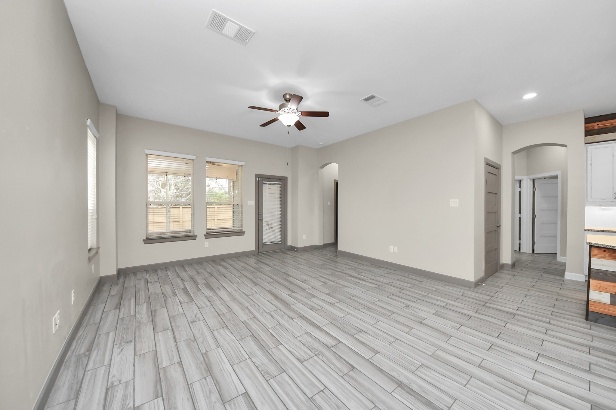 211 Pleasant Hill Way Conroe, TX 77304 - Photo 22 of 50 a view of an empty room with a window